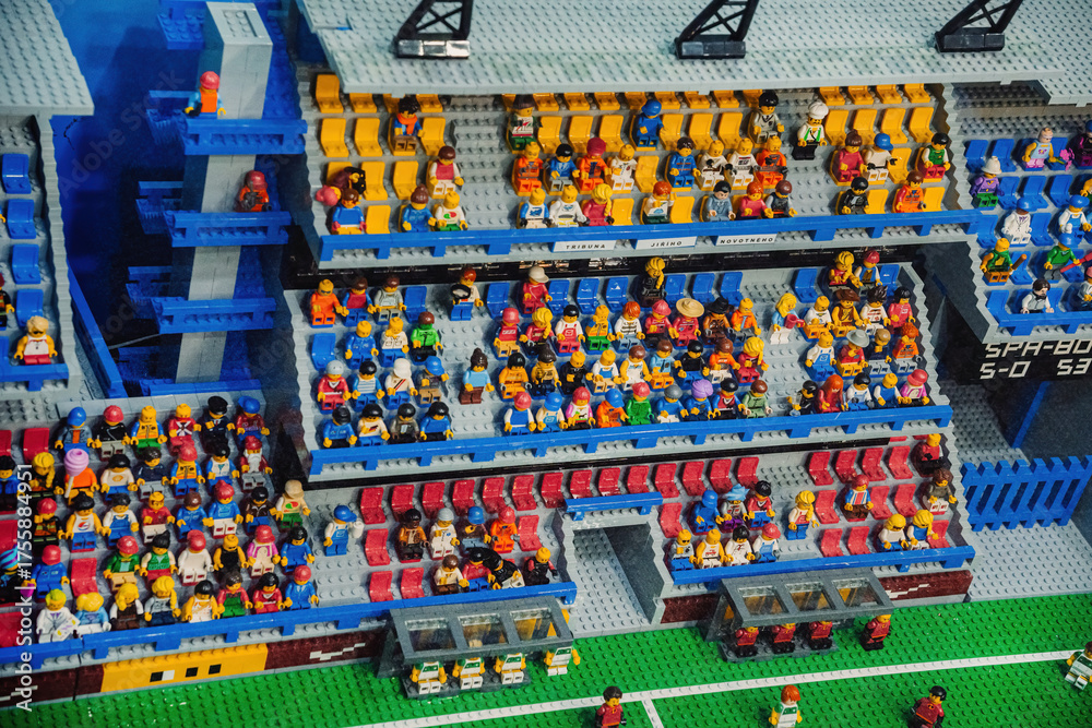 Naklejka premium Prague, Czechia - September 20, 2025: Colorful LEGO football stadium packed with cheering fans