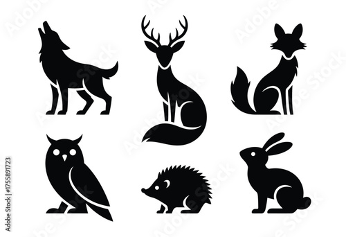 Set of vector silhouette illustrations of woodland animals including wolf deer fox owl hedgehog and rabbit vector illustration white background