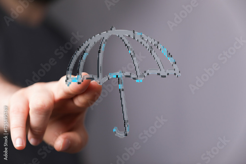 Person holding an umbrella ...