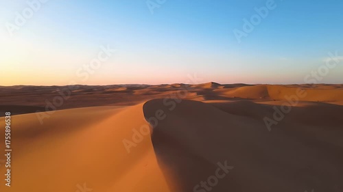 Desert sand dunes with sunset.