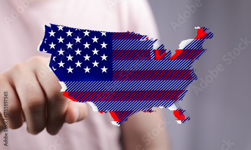 Hand pointing at US map des...