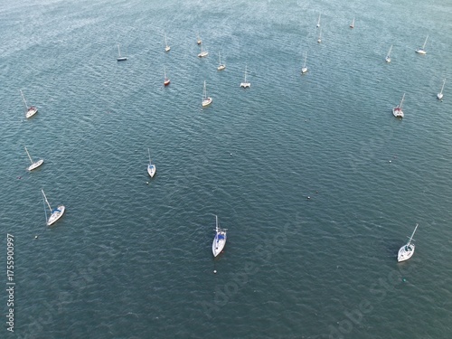 Aerial top view of boats and yachts in marina from above. Yacht parking, A marina lot, Yacht and sailboat is moored at the quay, Aerial view by drone.