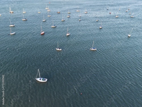 Aerial top view of boats and yachts in marina from above. Yacht parking, A marina lot, Yacht and sailboat is moored at the quay, Aerial view by drone.