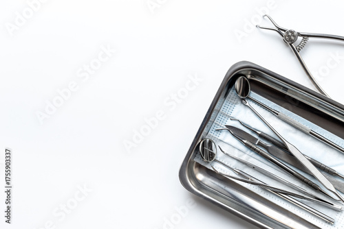 Dental equipment tools for teeth care on white background. Professional Dentist desktop, top view