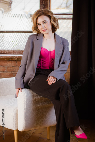 a young woman posing in a photo studio