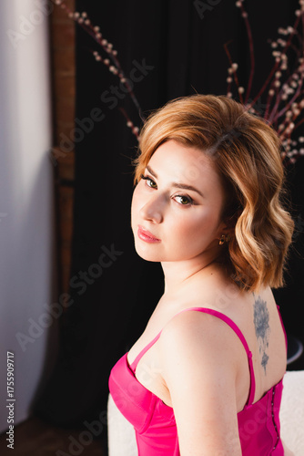 a young woman posing in a photo studio