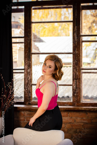 a young woman posing in a photo studio