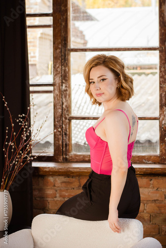 a young woman posing in a photo studio