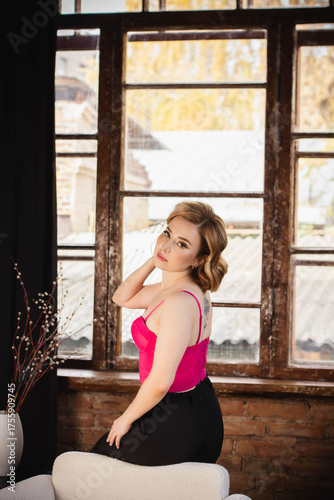 a young woman posing in a photo studio
