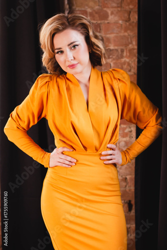 Blonde girl in a retro yellow dress