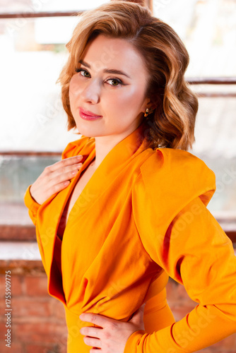 Blonde girl in a retro yellow dress