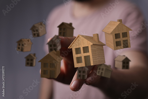 A hand holding a group of w...