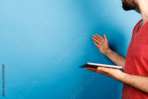 A person holding a tablet, ...