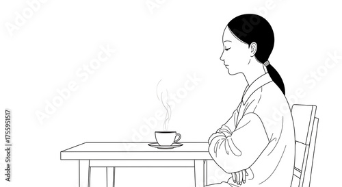 Peaceful Moment of a Woman Enjoying a Cup of Hot Beverage at a Table