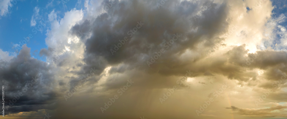 Obraz premium Stormy cumulus clouds forming during heavy thunderstorm on dark sky. Moving and changing cloudscape weather