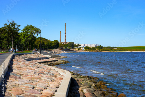 Thermal power plant and Radioactive Waste Repository hill as seen from the Sillamäe Beach Promenade along the Baltic Sea in a former Soviet closed city now located in Estonia