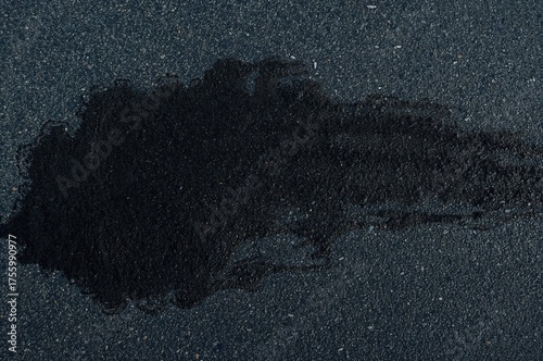 Dark rubber streak on racing track, artistic pattern and background of car tire skid from above, automotive concept.