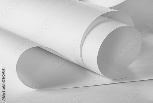 A roll of white paper in black and white.