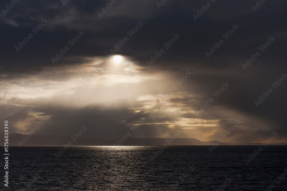 Obraz premium Dramatic skies across the Porsangerfjorden from Honningsvåg, Nordkapp, Finnmark, Northern Norway