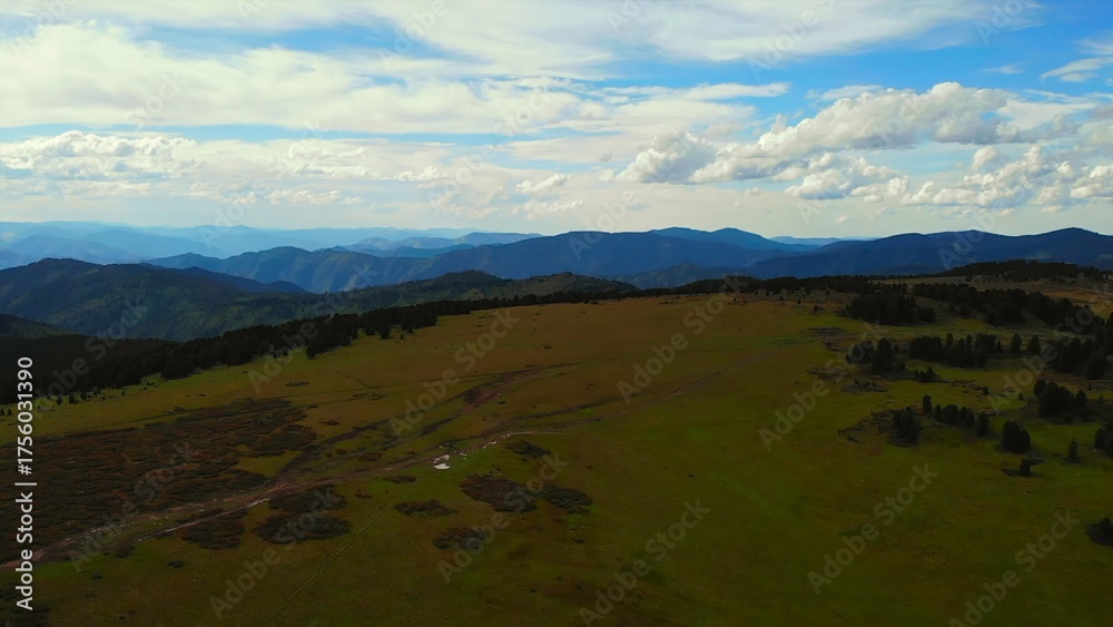 Obraz premium Aerial view flying over green mountain plateau. Media