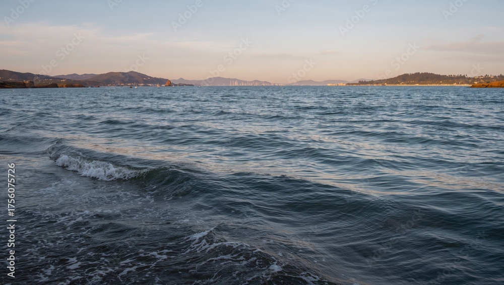 Obraz premium Waves ripple across the harbor waters
