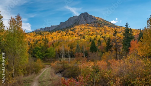 Fototapeta Naklejka Na Ścianę i Meble -  Vivid Scenery Featuring Tall Mountain Range in the Distance