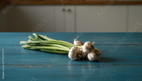 Cluster of garlic on a blue...