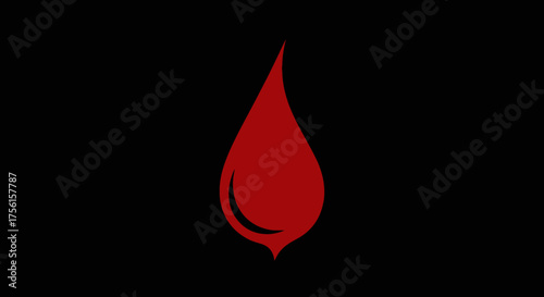 A singular drop of deep red liquid against a stark, black backdrop
