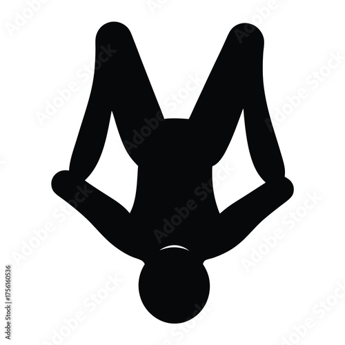 Silhouette of a person doing a handstand with legs spread upward