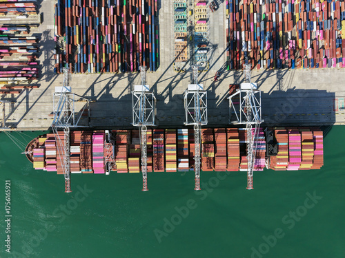 Aerial top view container ship full load container for logistics import, export, shipping or transportation concept background.
