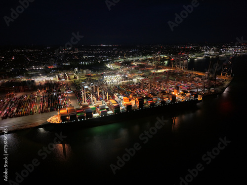 Aerial top view container ship full load container for logistics import, export, shipping or transportation concept background.