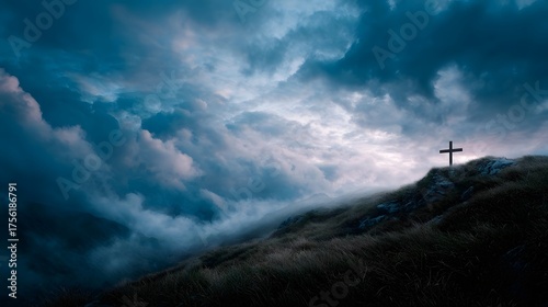 A solitary cross stands on a rocky hilltop against a dramatic cloud filled sky