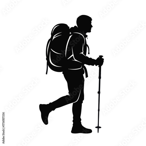 Backpacker with large rucksack and trekking poles a dramatic silhouette