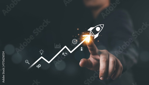 Fotografi Businessman pointing at rocket icon launching upward on growth chart, symbolizing business success, startup innovation, financial growth, digital strategy, and achievement in modern technology