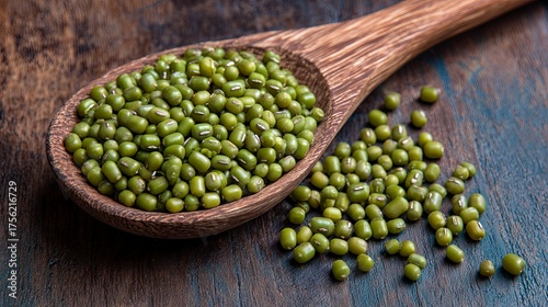 Green Mung Beans in Wooden Spoon on Rustic Wooden Surface for Healthy Food and Vegetarian Cooking