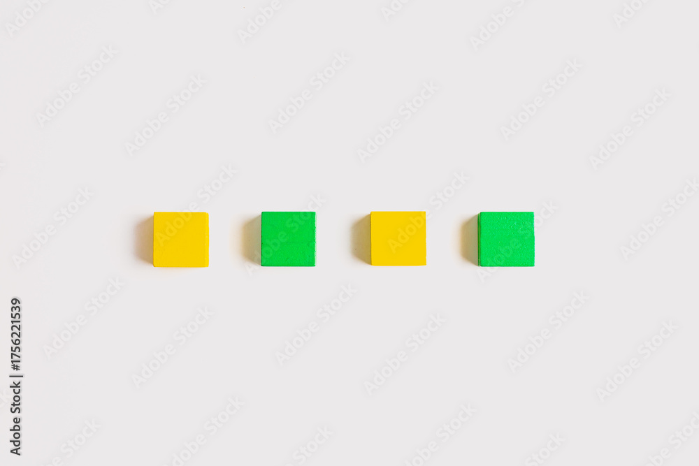 Fototapeta premium Four Colorful Wooden Blocks in a Straight Line