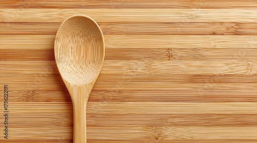 Wooden Spoon on Bamboo Cutting Board in Kitchen Setting