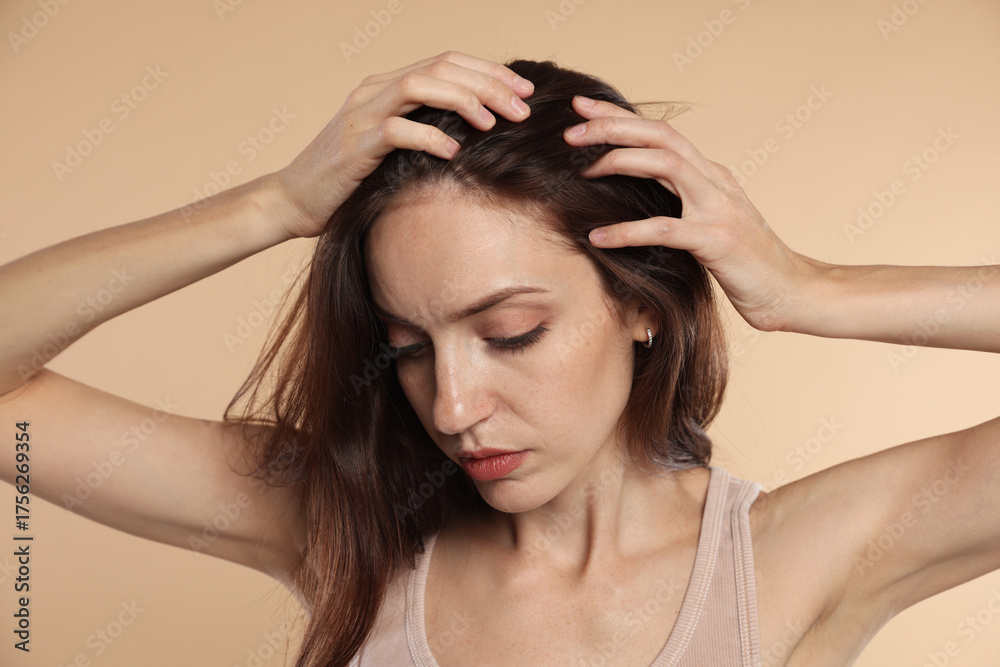 Fototapeta premium Woman with hair loss problem on beige background