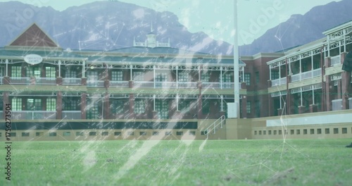 Capturing brick building featuring covered verandas on green lawn, with network code overlays