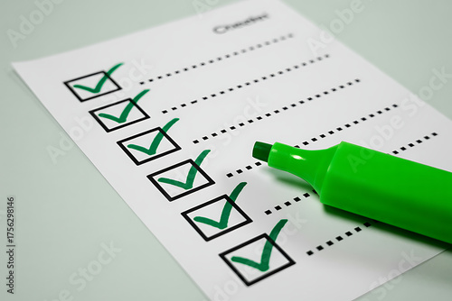 Green marker checking off items on a todo list with checkboxes