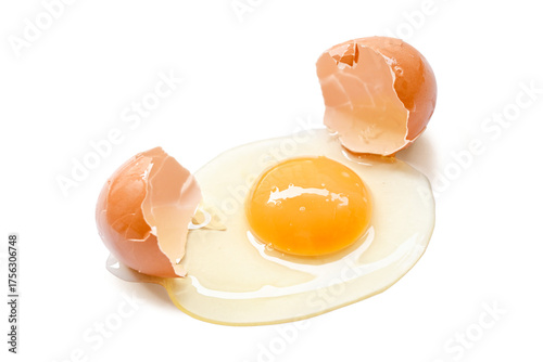 single broken egg with yolk isolated