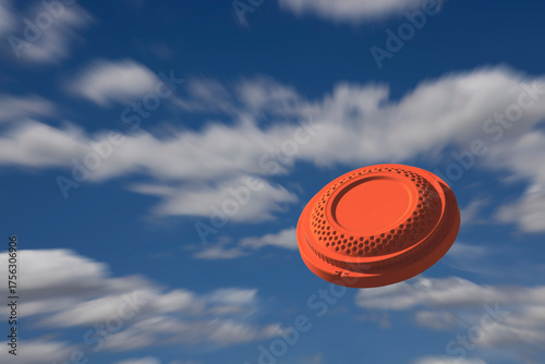 Flying clay pigeon target in the blue sky background , shotgun shooting game