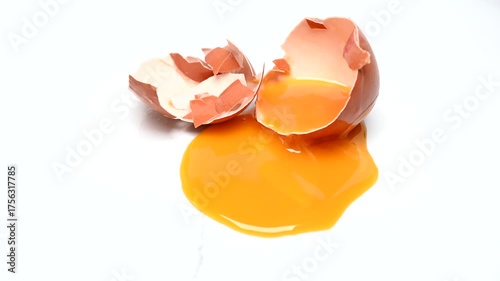 single broken egg with yolk