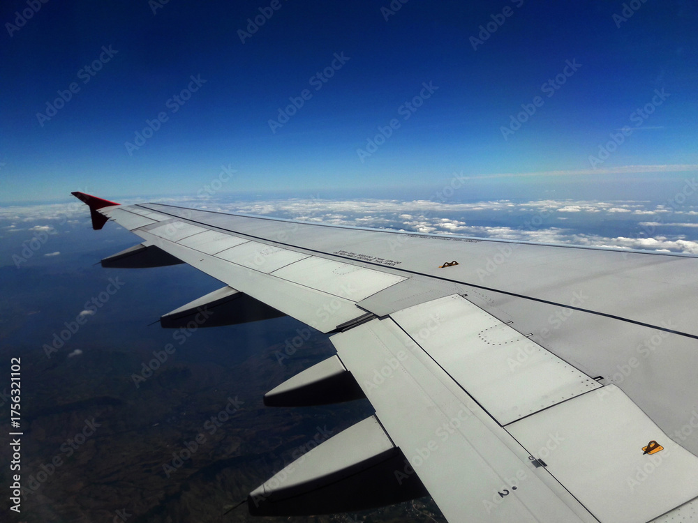 Fototapeta premium Airplane window view, Airplane flying in the sky, Airplane wing&nbsp;,Airplane wing, In-flight sky view