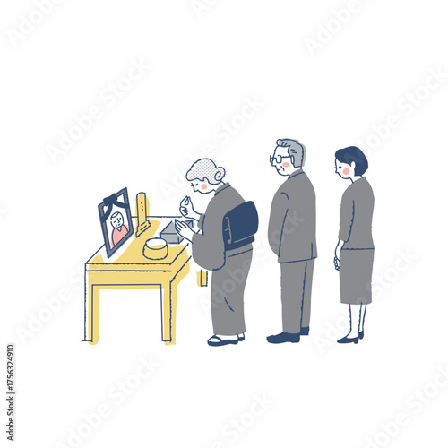 お葬式で焼香台に立つ喪服の参列者