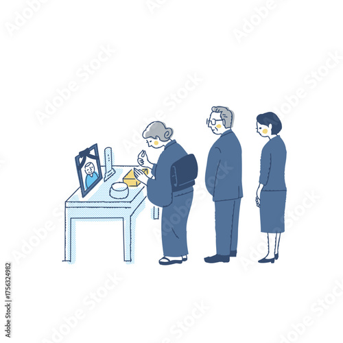 お葬式で焼香台に立つ喪服の参列者