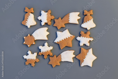 Decorated gingerbread cookies on a gray background. Christmas baking