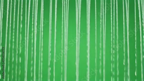 Dynamic water streams cascade against vibrant green backdrop, perfect for adding flowing movement and refreshing visuals to your creative projects