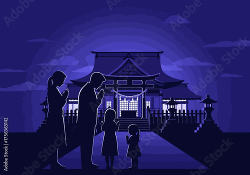 A family of four in silhouette bowing before a traditional Japanese Shinto shrine at night