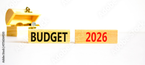 Budget 2026 symbol. Concept words Budget 2026 on beautiful wooden blocks. Beautiful white paper background. Beautiful wooden chest with coins. Business and budget 2026 concept. Copy space.